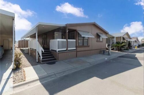 Brown double wide mobile home.