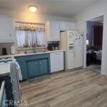 Kitchen with refrigerator.