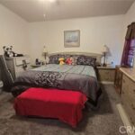 Master bedroom with bed and chest.
