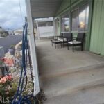 Porch with table and chairs.